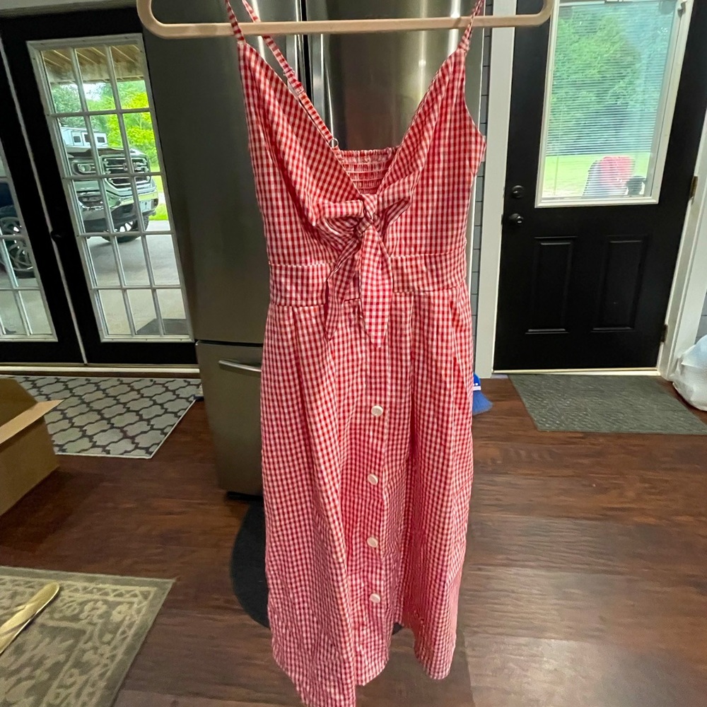 Selling a plaid dress with bow, perfect for holidays, worn only once